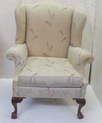 Upholstered Winged Arm Chair in Queen Ann Style:: Upholstered Winged Arm Chair in Queen Ann Style: Arched Crest over Shaped Wings down to Rolled Arms. Cabriole Legs with Carving at Upper End, down to Claw & Ball Feet. Single Loose Cushion Seat. Beaut