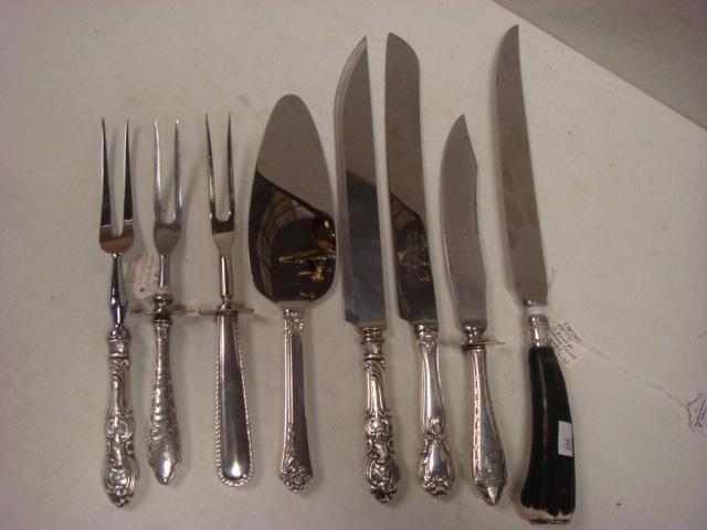 Eight Serving Pieces with Sterling and Antler Handles:: Eight Serving Pieces with Sterling and Antler Handles: Two Fork and Knife Carving Sets, Carving Fork, Web Sterling Handled Cake Knife, Cake/Pie Server and Antler Handled Knife with Sterling Collar. (1