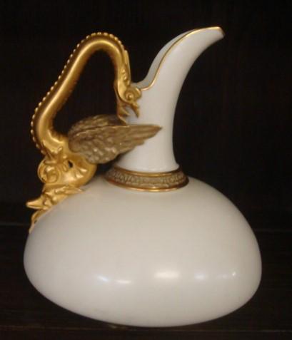 ROYAL WORCESTER Porcelain Ewer w/Gilt Dragon Handle:: ROYAL WORCESTER Porcelain Ewer w/Gilt Dragon Handle: Squat Ovoid Form with Gilded Dragon Form Handle. Gold Collar on Cream Ground. Excellent Condition, No Chips or Cracks. CA 1891. 7 3/4" Tall. Stunni