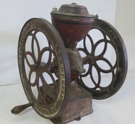 Enterprise Mfg. Co. Cast Iron Coffee Grinder:: Enterprise Mfg. Co. Cast Iron Coffee Grinder: Double Wheel Grinder is 21"T-made to be Mounted on Counter Top of General Store. Porcelain Knob. Made in Philadelphia, USA. Traces of Red Paint. (300-500)
