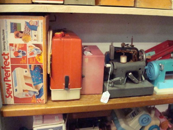 15 Vintage Toy Metal and Plastic Sewing Machines: 228C. 15 Vintage Toy Metal and Plastic Sewing Machines: Includes Casige, Little Betty, Kayanee, Sewmatic, Mattel Sew Perfect with Patterns, Singer Jr Miss, Frankomia. In Played With Condition.