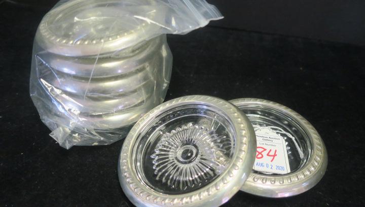 Seven Mid Century Glass and Sterling Coasters:: Seven Mid Century Glass and Sterling Coasters: "WSC4" Lemon Fork. 49 Oz or 41.3092 ozt Minus Each is 4"D with Impressed Pattern on Bottoms. Rims Marked Sterling sTc. (50-100)