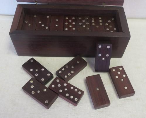 Dominoes Set, Rosewood and Sterling Silver:: Dominoes Set, Rosewood and Sterling Silver: Boxed Set of 28 Tiles, Each Set with Sterling Silver Pips & Pins. The Rosewood Box with Silver Dividing Lines and Oval Plate on Top. 23/4"T X 7"W X 2 3/4"D.