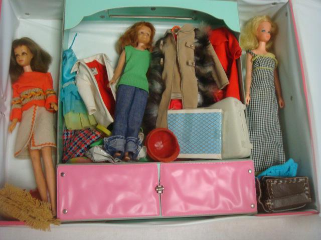 Two Vintage Barbie's and Scooter in Case w/Clothes:: Two Vintage Barbie's and Scooter in Case w/Clothes: Blonde Twist & Turn Busy Barbie has Hands with Moving Thumbs to Hold Accessories. Bendable Legs, Arms and Wrists. Ca. 1971. Repaired Arm. Brunette B