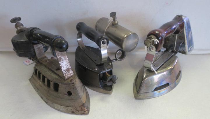 Three Antique Gas Sad Irons:: Three Antique Gas Sad Irons: American Gas Machine Co Cast Iron with Nickle Side Tank. Impressed Name on Top with Patent Applied For, Albert Lea, Minn. Wooden Handle. Early 1900's. Very Good Condition.