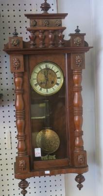 Antique German Regulator Walnut Cased Wall Clock:: Antique German Regulator Walnut Cased Wall Clock: Face has Porcelain Face Ring with Roman Numerals. Gilt Metal Center. Half Column Sides of Door with Small Half Columns and Rosettes at Top. Has Key an