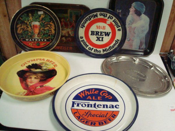 7 Beer Serving Trays: 1554. 7 Beer Serving Trays: Olympia Beer, Frontenac, Watneys, M & B Brew XI a Pint of the Midlands, Corona Liqueurs and Drinks, Budweiser and Drink Coca-Cola.