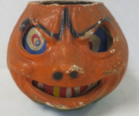 Fierce Looking Vintage Papier Mache Pumpkin:: Fierce Looking Vintage Papier Mache Pumpkin: Has Original Paper Insert with Red, White and Blue Eyes, Red & White Teeth. (1 Yellow Tooth) Condition Fair, Wire Handle Missing, Some Color Rubbed. 5 3/4"