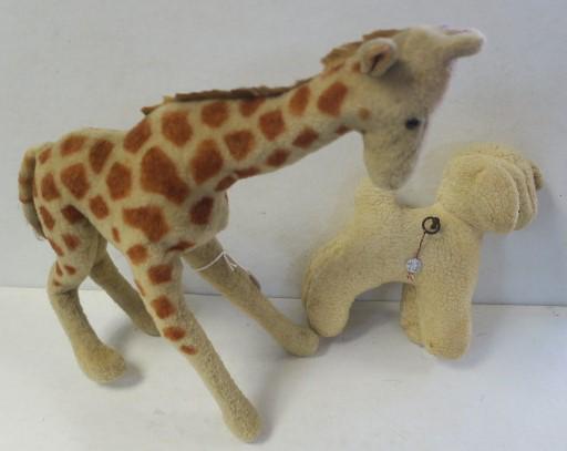 STEIFF? Giraffe and Lamb with Thorins Music Box:: STEIFF? Giraffe and Lamb with Thorins Music Box: Giraffe in Loved Condition, Missing Left Ear. Partial Tag on Leg Appears to Say U.S. Zone Germany. Shoe Button Eyes, Excelsior Stuffing. 16"T. Plush 9"
