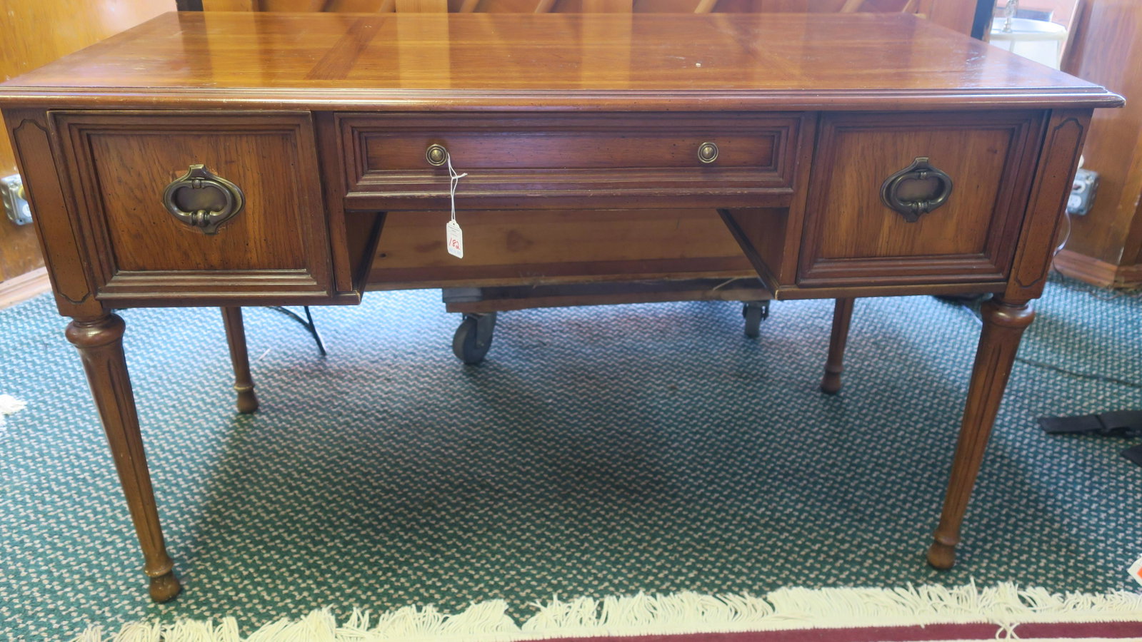 Modern Oak Ladies Desk with Paneled Top:: Modern Oak Ladies Desk with Paneled Top: Molded Edge over Center Drawer Flanked by Deep Drawer on each Side. Raised on Round Grooved Tapered Legs Set on Rounded Feet. Pen/Pencil Cradle in Center Drawe