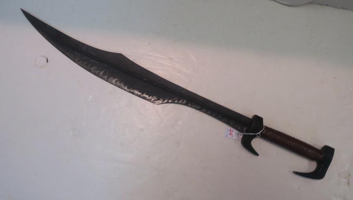 Spartan Sword, Replica: Spartan Sword, Replica Featured in Movie "300". In addition to a Thrusting Sword Weighed End Gives this weapon a "Chopper" Effect Leather Wrapped Grip with Double Open Guard. 25" Blade, 35" LOA. (200-