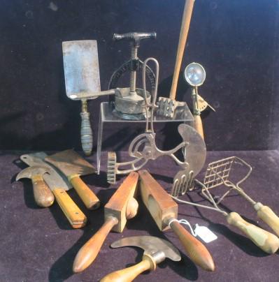 Collection of Assorted Vintage/Antique Kitchen Items:: Collection of Assorted Vintage/Antique Kitchen Items: Cast Iron Meat Juice Press CA 1890's. Large Wooden Press/Juicer. Two Potato Mashers, Heavy Spatula, French Hachinette, Small Chopper, Shapleigh's