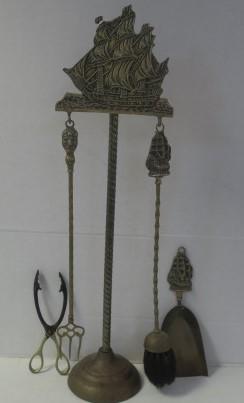 Vintage Brass Fireplace Tools with Stand:: Vintage Brass Fireplace Tools with Stand: Brass Stand with Sailing Ship at Top Holds Short Shovel and Broom with Ship, Short Handled Tongs and Fork with Mask at Top. (80-160)