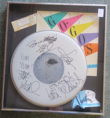 GO-GO'S AUTOGRAPHED DRUM HEAD, Greatest Female Band:: GO-GO'S AUTOGRAPHED DRUM HEAD, Greatest Female Band: Singed by BELINDA CARLISLE, GINA SCHOCK, KATHY VALENTINE and JANE WIEDIN With Flourishes. Frame includes Ticket to Bay Front Arena Concert Ticket f