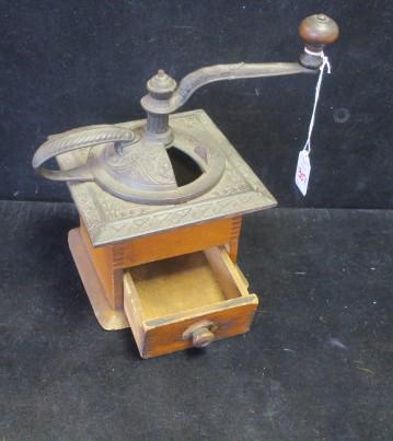 Finger Jointed Antique Coffee Grinder:: Finger Jointed Antique Coffee Grinder: Grinder with Embossed Iron Lid and Square Top and Handle. Corners Worn. Some Scuffing. 6" X 6", 4 3/4"T. C 1920. (50-100)