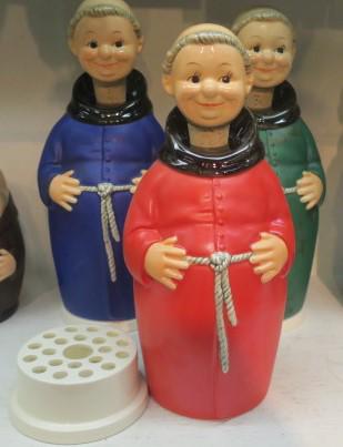 Three GOEBEL FRIAR TUCK DECANTERS & CIGARETTE TRAY:: Three GOEBEL FRIAR TUCK DECANTERS & CIGARETTE TRAY: Red, Blue and Green Friar Tuck Decanters with Cigarette Tray under Decanter. Cork Stopper. (100-200)