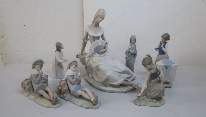 Seven Matte Finish LLADRO Figurines:: Seven Matte Finish LLADRO Figurines: Girl with Outstretched Hands, Two Boy with Bird "Pleasant Encounters", Madonna with Lilies, Girl Picking Flowers, Girl with Iron and Large Spanish Senorita with Fa