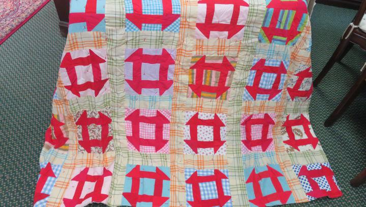 Vintage Machine Stitched Quilt:: Vintage Machine Stitched Quilt: Multicolor Striped, Plaid and Floral Panels with Red Square Shapes. Gray Backing. 68" X 80". (100-200)