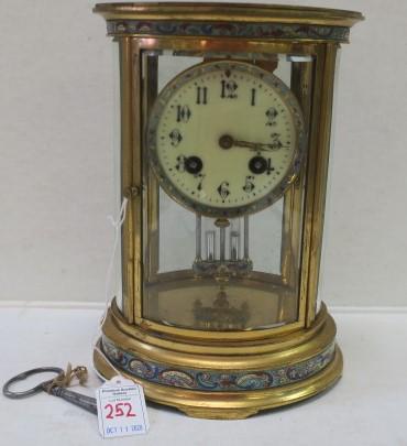 French Crystal and Cloisonne Mantle Clock:: French Crystal and Cloisonne Mantle Clock: Oval Clock with Crystal Regulator, Cloisonne Trim on Bezel, Top and Bottom of Case and Pendulum. "Made in France" Written on Movement. Beveled Glass on Back 