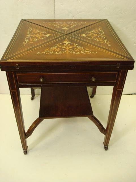 Marquetry Inlaid Hinged Handkerchief Game Table: Marquetry Inlaid Hinged Handkerchief Game Table: Rosewood with Contrasting Fruitwood. Leaf Missing On Vine. Inside has Green Felt Surface. Dice Cups at Corner of Each Fold Out Leaf. Line Inlaid Square