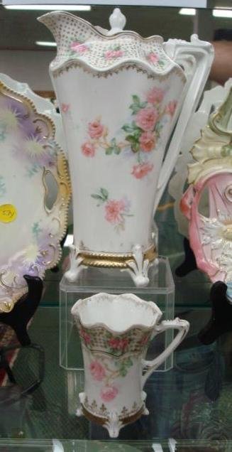 R.S. PRUSSIA Red Mark Mold 704 Chocolate Pot and C: R.S. PRUSSIA Red Mark Mold 704 Chocolate Pot and Cup: 9"T Chocolate Pot With Pink Rose Transfers and Gold Accents has Matching 3 1/2"T Cup. Some Wear to Gold (100=200)