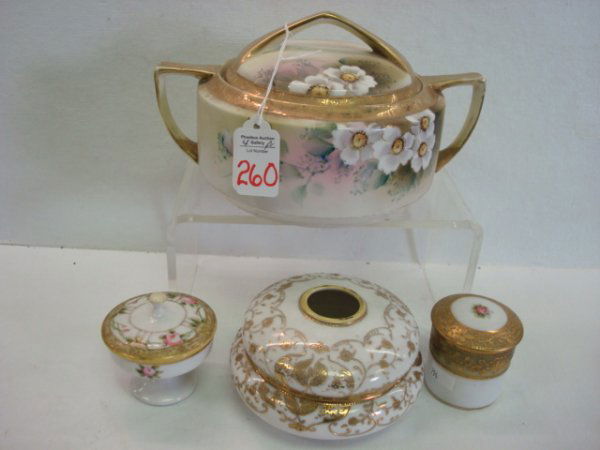 Hand painted NIPPON Tableware Pieces: Hand painted NIPPON Tableware Pieces: 6 1/2"D Double Handled Lidded Cache Pot with Blue Maple Leaf Mark, 5"D Hair Receiver with Green Maple Leaf Mark. 2 1/4" and 3"T Lidder Dresser Jars with Blue and