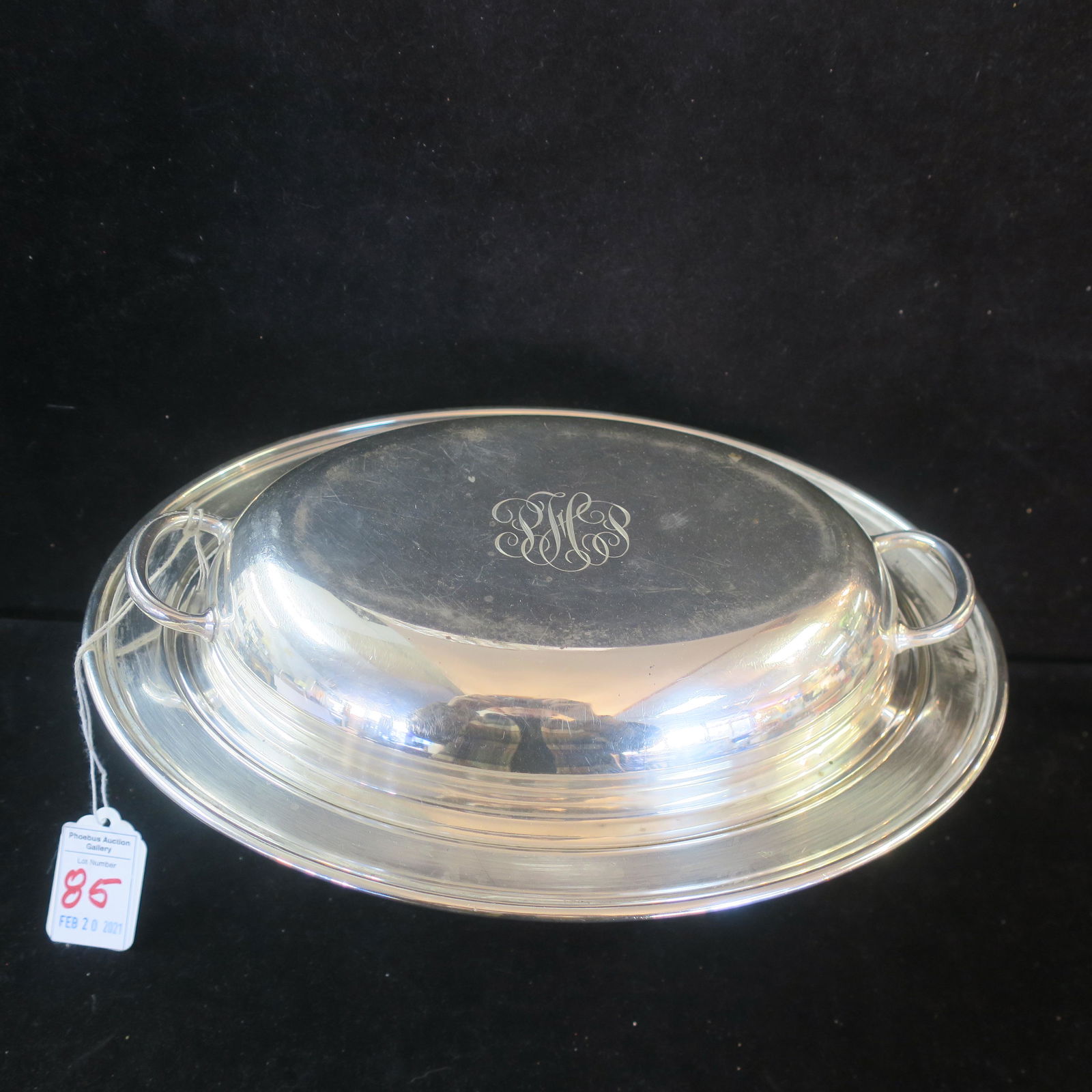 Sterling Silver Two Piece Oval Serving Dish:: Sterling Silver Two Piece Oval Serving Dish: Oval Base and Handled Lid Which can Double as a Separate Dish is 11" X 8 3/4". Monogrammed Lid. Marked Sterling on Bottom and Under One Handle. 28.7 Oz. (6