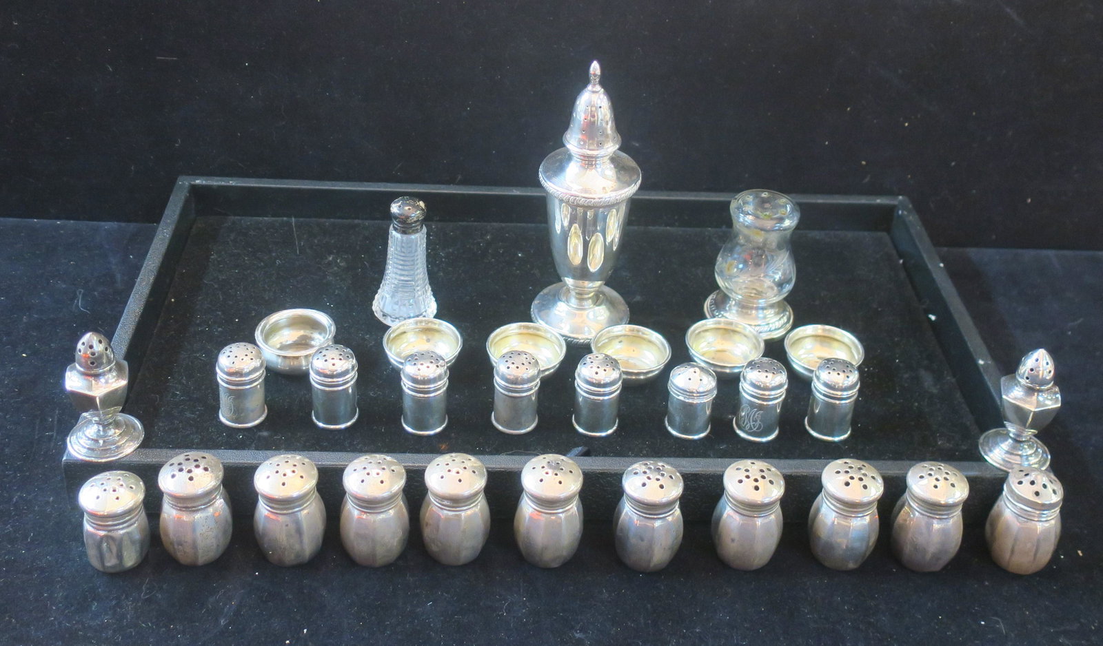 Assorted Sterling Silver Salt Shakers and Dips:: Assorted Sterling Silver Salt Shakers and Dips: Ten Lord Silver Inc. 1 1/2"T Shakers with Non Corrosive Plastic Liners in Original Boxes. 1 1/4"T Shaker, 8 Gorham 1 1/4" Monogrammed Shakers, Extra Lid