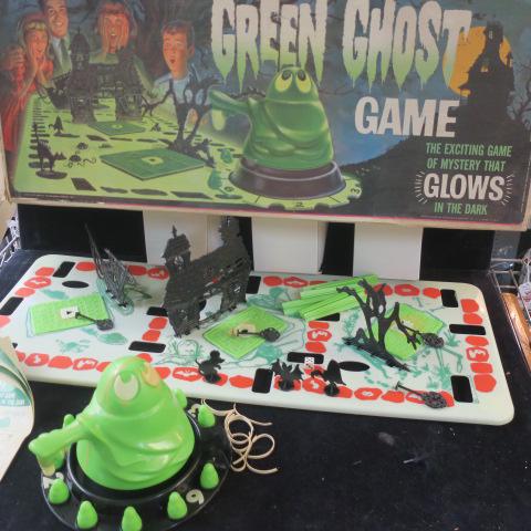 TRANSOGRAM "GREEN GHOST GAME": TRANSOGRAM "GREEN GHOST GAME" The Exciting Game of Mystery that Glows in the Dark. Big Spinner Ghost and Hidden Boxes of Bat Feathers, Sticks & Snakes. Missing Cat Marker and Some Numbers. Box end Fla