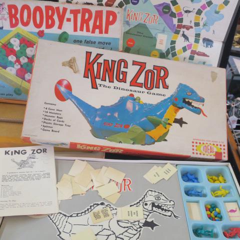 BOOBY TRAP and KING ZOR Games:: BOOBY TRAP and KING ZOR Games: Booby Trap is a Tense, Tantalizing Terrific Game of Exploding Pieces. King Zor is a Dinosaur Game of Collecting Species and Eggs by IDEAL. Boxes Fair Parts Present. (50-