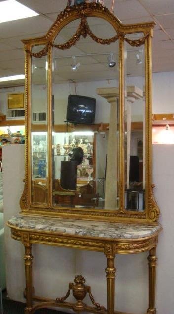 Louis XVI Goldleaf Mirror, Marble Console Table:: Louis XVI Goldleaf Mirror, Marble Console Table: Triptych Mirror, 46" X 72"T White & Black Marble Inset on Demi Lune Table Top with Ribbon Apron & Reeded Tapered Legs. Has Cross Stretcher Base with Ce