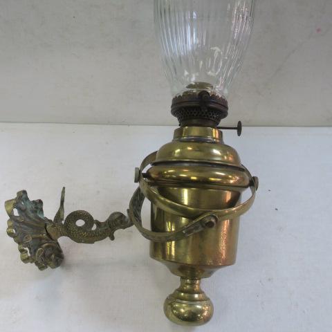 Vintage Brass Gimbel Sailboat Swivel Oil Lamp:: Vintage Brass Gimbel Sailboat Swivel Oil Lamp: Attached Ornate Arm with Dolphin Figure Attached to Wall. Added Glass Shade. Some Wear to Metal. Burner to Burner 8" Deep. (40-80)