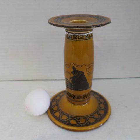 ROYAL DOULTON Rare "Witches" Candlestick:: ROYAL DOULTON Rare "Witches" Candlestick: Mustard Ground Transfers of 3 Witches Over Cauldrons, Greek Key at Top and Bottom and Leaf Vine Around Foot and Top. CA 1906-1938. Royal Doulton Stamp on Bott