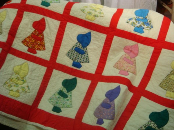 Red and White Sunbonnet Sue Quilt:: Red and White Sunbonnet Sue Quilt: Sewn and Hand Quilted Quilt is 68" X 80". White Field with Colorful Appliqué Patchwork Fabric.