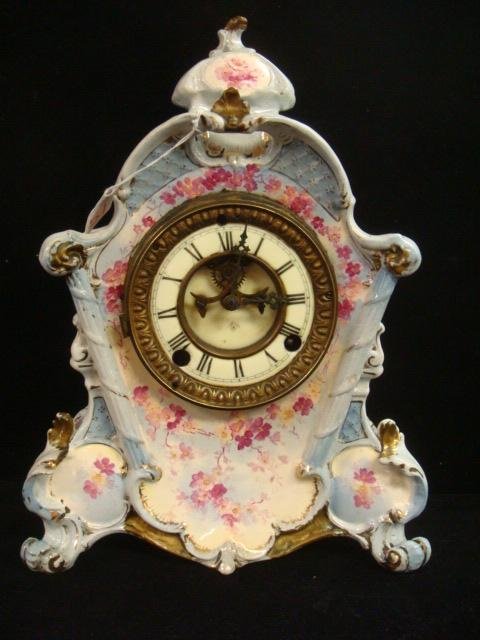 ANSONIA Clock with ROYAL BONN Case:: ANSONIA Clock with ROYAL BONN Case: Ansonia Works Fit into a 13 1/2"T Ceramic Royal Bonn Case with Pink Cherry Blossom Transfers. Porcelain Dial with Open Escapement. Has Key and Pendulum. Needs Work.