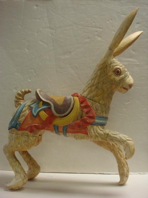 Carousel Style Hand Carved Painted 9 Piece Rabbit: Carousel Style Hand Carved Painted 9 Piece Rabbit: Mid 20thC. 31"T, 23"L. Handpainted Detailed Carved Wooden Stander with Head and One Paw Up. Age Appropriate Wear.