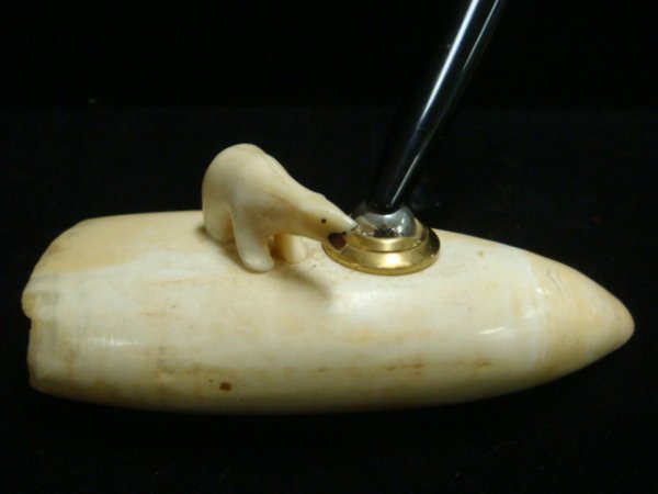 Ivory Tusk Pen Holder with Pen, Carved Polar Bear: Ivory Tusk Pen Holder with Pen, Carved Polar Bear: 5 1/4"L, 2"W at Opening. 1 1/2" Bear with Open Mouth Stands on Alaskan Tusk. Mounted Pen.