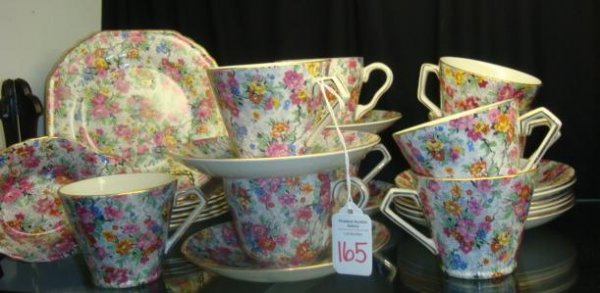 BCM/NELSON WARE England "Marina" Chintz Tableware: BCM/NELSON WARE England "Marina" Chintz Tableware: Includes Six 6 1/2" Square Plates, 9 Cups (2 with Rounded Handles, 1 with Repaired Handle), 10 Saucers, and 5 3/4"L Oval Nut Dish Marked Lord Nelson 