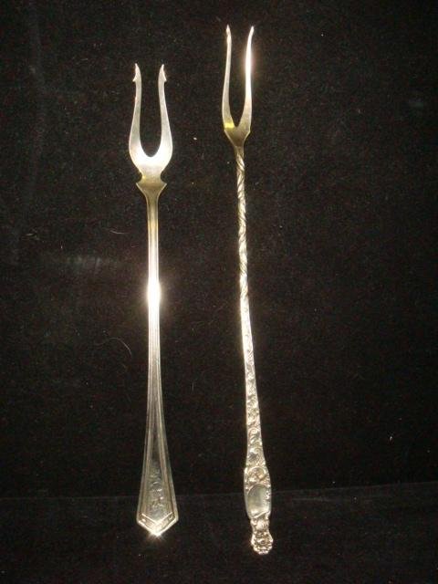 2 Sterling Silver Long Handle Forks:: 2 Sterling Silver Long Handle Forks: WHITING Heraldic 9"L Pickle/Olive Fork, Date of Issue 1880. STERLING SILVER MANUFACTURING CO. 8"L Pickle/Olive Fork with R Monogram. 1.530 ozt.