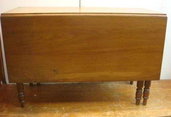 19th C Mahogany Drop Leaf Table: 19th C Mahogany Drop Leaf Table: 43 1/2"L X 19"L X 29 1/2"T. 18 1/2" Drop Leaves. Hand Turned Legs.