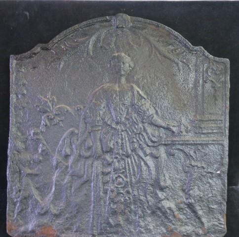 CA 1750 Cast Iron Fireback with Stand:: CA 1750 Cast Iron Fireback with Stand: Fireback Depicts an Embossed Colonial Female In Gown with Background of Scrollwork and Foliage. Puddled Back. Firebacks were placed against the Back Wall of a Fi