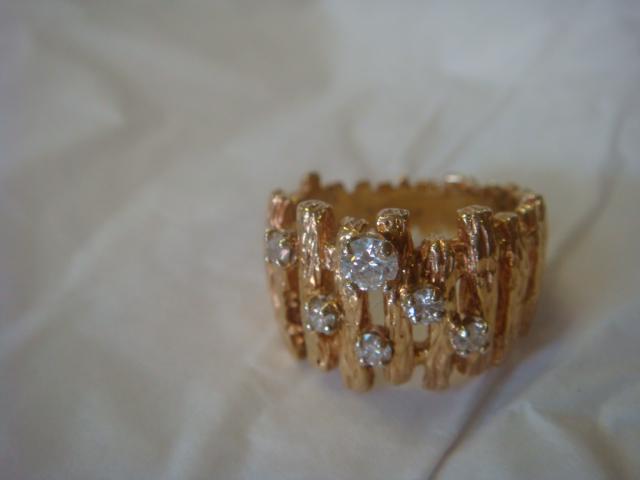 Ladies 14KT Yellow Gold Diamond Ring:: Ladies 14KT Yellow Gold Diamond Ring: Size 7 1/2 Polished Cigar Style Band with Circular Bars Supporting Vertical Sticks in an Openwork Graduated Band. 6 Angular Prong Set Round Diamonds. Weight is 10