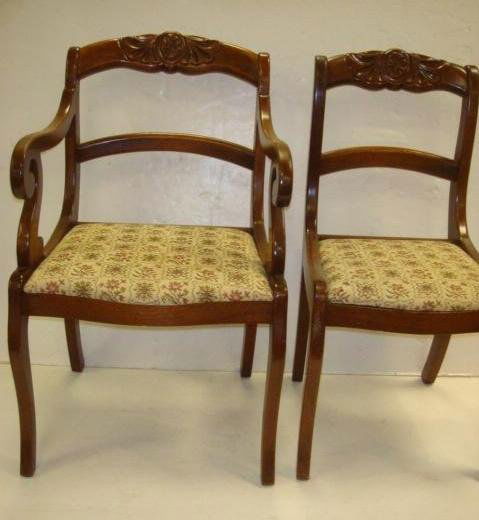 3 Side, 1 Arm Carved Crest Rail Dining Chairs: 3 Side, 1 Arm Carved Crest Rail Dining Chairs: Winged Floral on Crest, Curved Horizontal Back Rail, Saber Legs. Arm Chair has Scrolled Hand Rests, Tapestry Upholstery, Set In Seats. 4th Chair was Snac