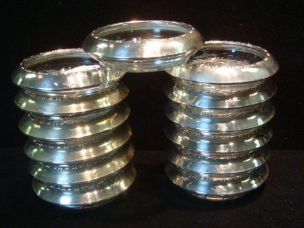 13 Glass with Sterling Silver Rim Coasters: 13 Glass with Sterling Silver Rim Coasters: 4"D Coasters have Raised Pattern on Rim and Marked Amston Sterling. Raised Leaf Pattern in Bottom.