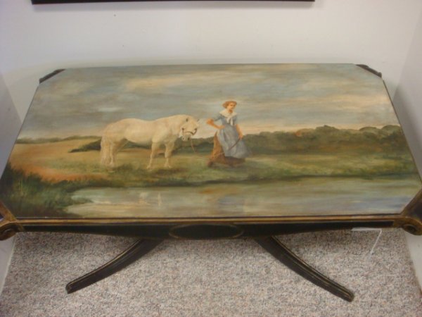 Black Coffee Table with Handpainted Scenic Top:: Black Coffee Table with Handpainted Scenic Top: Top Has Folk Art Painting of Lady with White Horse in Field (Covers Entire Top). Mahogany Frame is Painted black with Gilt Accents. 36" X 20" X 17 1/2".