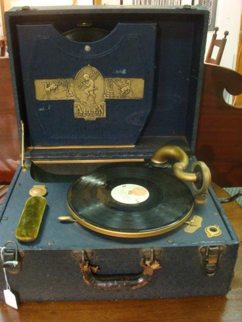 Vintage ALLEN Portable Record Player in Case: Vintage ALLEN Portable Record Player in Case: Built In 78 Record Storage Case. Includes 7 78's on Okeh and Victor Labels. Side Crank. Nice Allen Co. Logo Inside. Tear in Case. Circa 1920-1930.