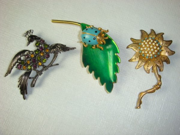 HATTIE CARNEGIE Trembler, Floral and Peacock Pins: HATTIE CARNEGIE Trembler, Floral and Peacock Pins: 3" Turquoise Lady Bug on Enameled Leaf. Filigree Leaf Flower with Inset Bead Center and S Shaped Stem. Spread Wing Peacock on Branch with Purple, Gol