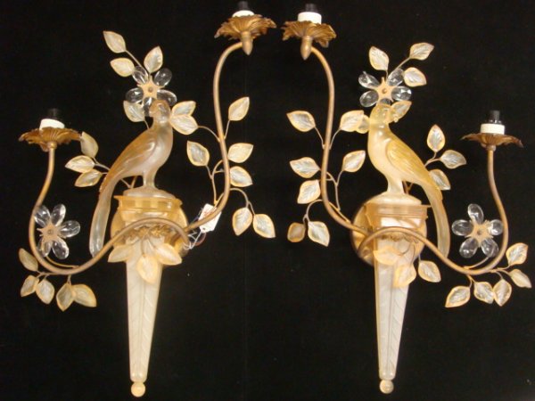 Pair of Double Arm Electric Lucite Sconces:: Pair of Double Arm Electric Lucite Sconces: Art Deco Style Metal Frame with Applied Leaves, Slide in Torch with Parrot Cap. Glass Prism Floral. Incandescent Luminaire. 22"T X 15"W. Some Repairs.