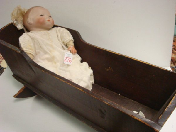 Grace Putnam BYE-LOW Baby in Cradle:: Grace Putnam BYE-LOW Baby in Cradle: 14" Socket Head Doll with Rosy Cheeks and Brown Eyes. Corp. by Grace S Putnam Germany Marked on Head. Frog Shaped Cloth Body is Stamped with Red. Head Damaged and 