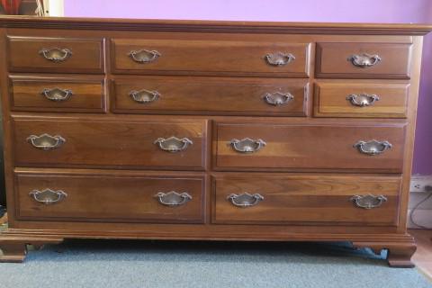 CHERRY 10 Drawer Low Dresser: 6 Drawers over 4 Drawers,: CHERRY 10 Drawer Low Dresser: 6 Drawers over 4 Drawers, all with Bail Handles. Set on Ogee Bracket Feet Front and Back. Good Condition with Few Surface Scratches. 34"T X 60"W X 21"D. (150-300)